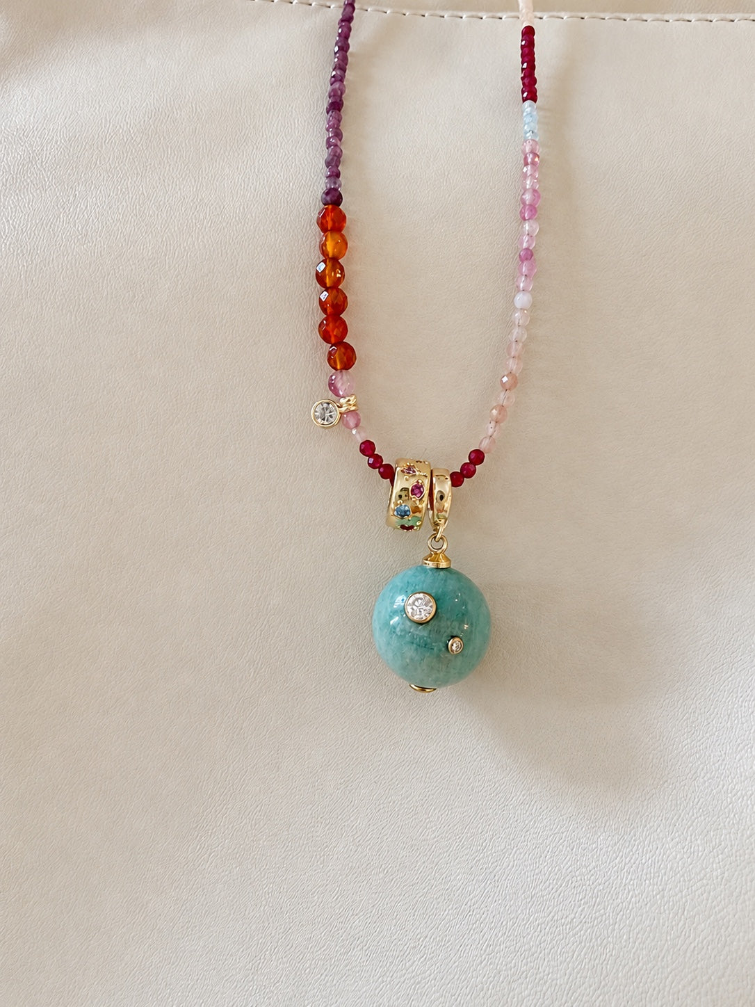 Celeste Relic on a colorful gemstone strand