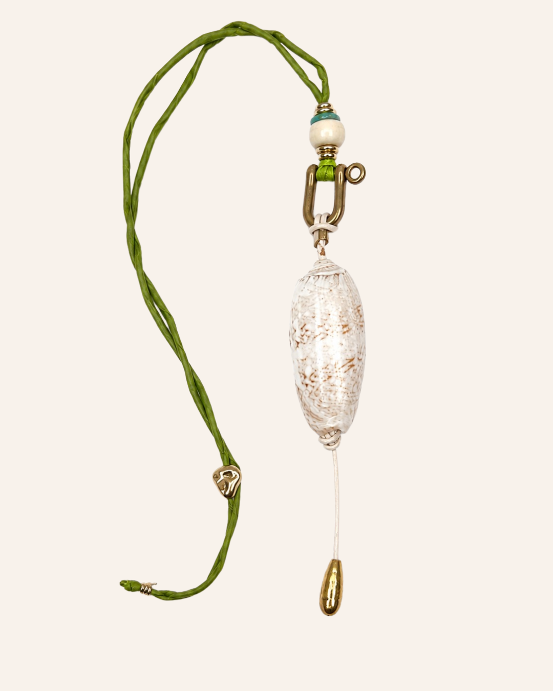 A bohemian-style pendant necklace featuring a textured, crackled clear glass oval pendant on a braided olive green cord, accented with a white bead and brass hardware.