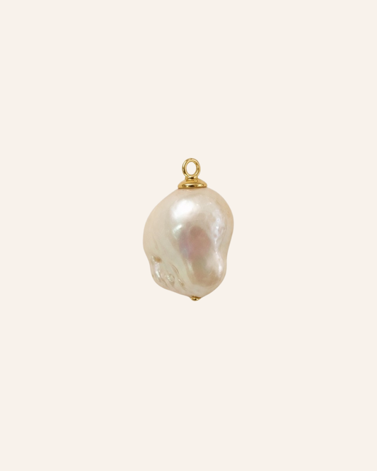 Baroque pearl with a gold bail  on a white background