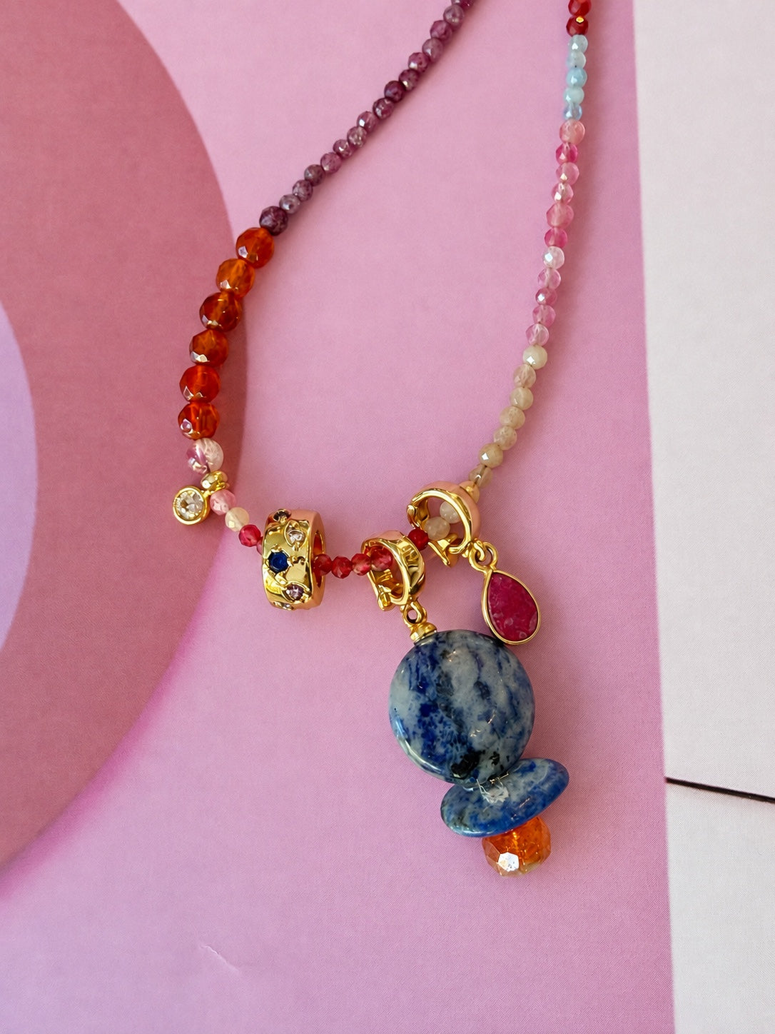 Livia pink tourmaline Relic shown with blue gemstone Relic, close-up
