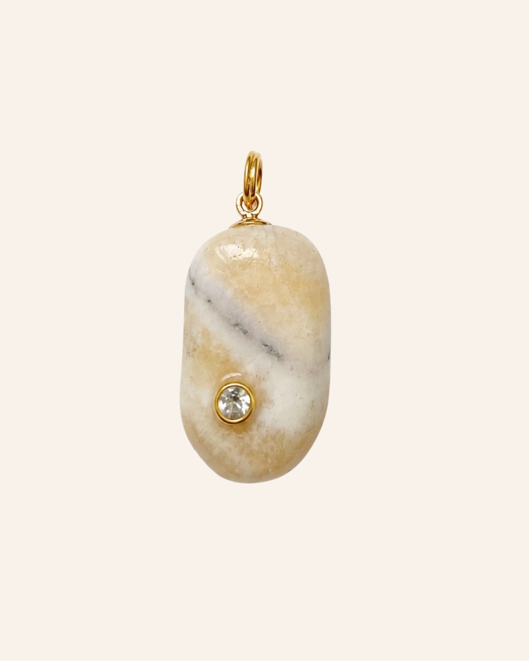 Lumen Relic No. 01, polished cream and pale honey calcite with natural gray veining, bezel-set moissanite and gold-tone hanging ring