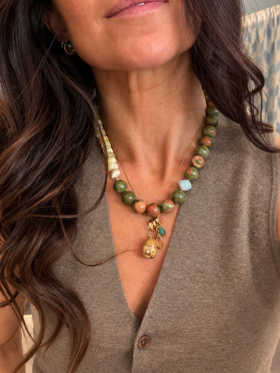 Noma Relic worn on a gemstone necklace