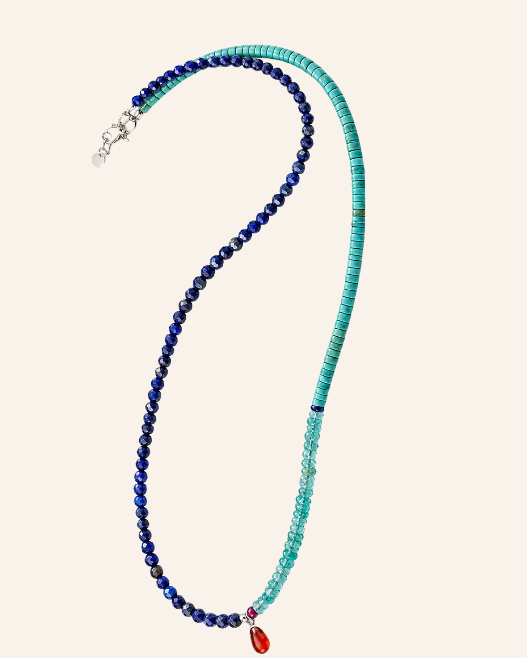 Port Scarlett Cyrene gemstone strand photographed on warm ivory