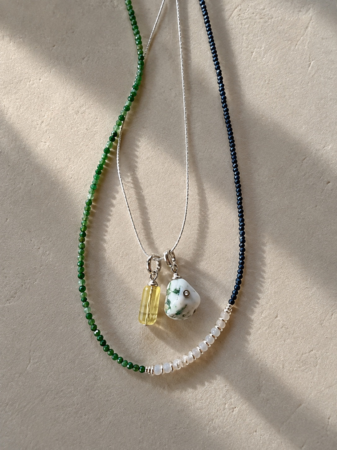 Sylva styled on a delicate chain alongside another Relic